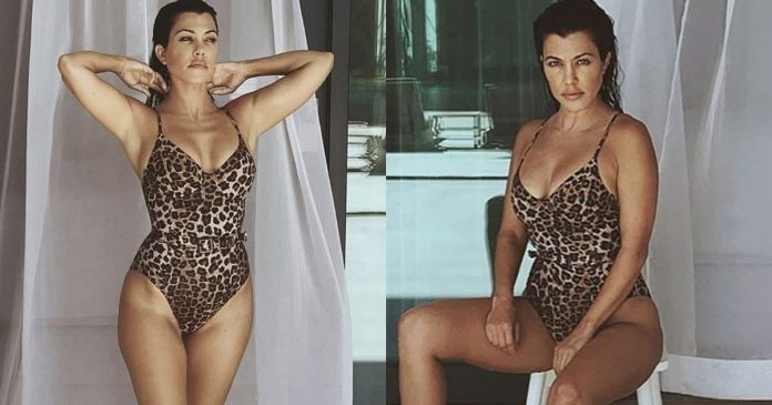 Kourtney Kardashian shows off her bomb figure in a leopard-print Good American swimsuit
